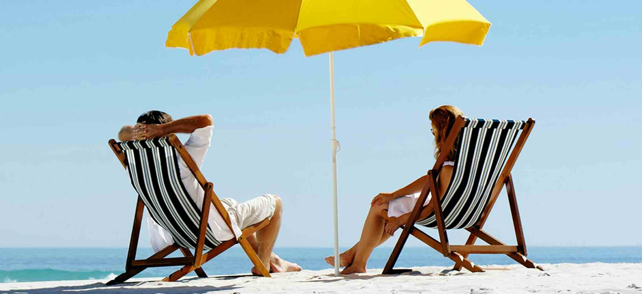 Couple sitting in beach chairs on the beach